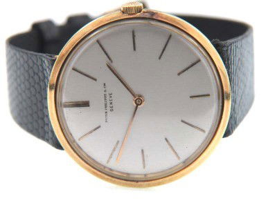 Patek Philippe 18K Yellow Gold Leather Strap Watch: Patek Philippe 18K Yellow Gold Leather Strap Watch The total watch's weight is 36.3 grams. The measurements of watch head is 29 x 33 mm and 5 mm thick. Dial: Gold Stick dial Movement: Manual The lengt