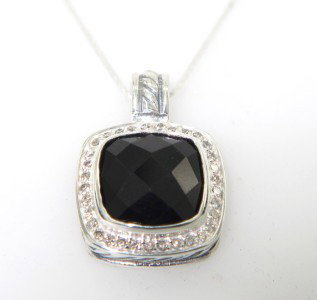 David Yurman Silver Onyx & Diamond Pendant: David Yurman Silver Onyx & Diamond Pendant. The total Pendant's weight is 3.3 grams. The total weight of diamonds is 0.20 cts. approximately I and SI clarity. The size of the Onyx is 12 x 11 mm. The s