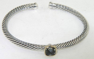 David Yurman Gold / Silver Prasiolite Bangle: David Yurman 18K Yellow Gold / Silver Prasiolite Bangle The total Bangle's weight is 19.4 grams. The measurement of prasiolite: 6 x 6 mm. The bangle size is 47 x 43 mm. 3 mm in thickness.