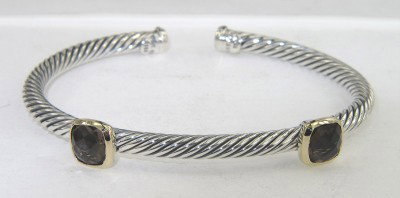 David Yurman 18K Yellow Gold/Silver Smoky Topaz Ba: David Yurman 18K Yellow Gold/Silver Smoky Topaz Bangle Bangle's Weight: 20.1 grams. The size of the smoky topaz is 6 x 6 mm. The measurements of the Bangle: 49 x 42 mm and the thickness is 3 mm. There