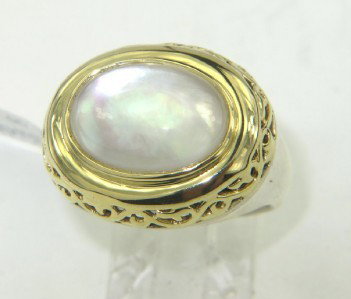 Charles Krypell Gold/Silver Chalcedony Ring: Charles Krypell 18K Gold/Silver Chalcedony Ring The total ring's weight is 8.2 grams. The size of the Chalacedony is 8 x 12 mm. The measurement of ring's surface is 15 x 18 mm and 7 mm thick. The size