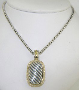 David Yurman Silver/18K Yellow Gold Diamond Necklac: David Yurman Silver/18 Yellow Gold Diamond Necklace The total weight of Necklace is 33.5 grams. The total weight of diamonds: 0.5 ct. approximately H color VS-SI clarity. The necklace is 21.5" long. T
