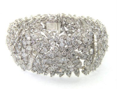 18K White Gold Diamond Bracelet: 18K White Gold Diamond Bracelet The total weight of Bracelet is 88.6 grams. The total weight of Diamond : 44.13 cts, I color and SI-1 clarity The measurement of bracelet: 8", 22 - 32 mm in width, 2 mm