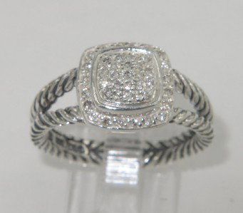 David Yurman Silver Diamond Ring: David Yurman Silver Diamond Ring The total ring's weight is 5.7 grams. The total weight of the diamond is 0.20 cts approximately, I color SI clarity. The size of the ring is 5.5. The measurement of ri