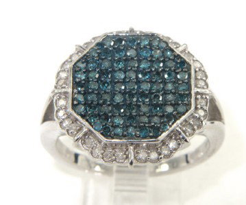 Silver Multi-Colored Diamond Ring: Silver Multi-Colored ( White/Blue) Diamond Ring The total ring's weight is 7.2 grams. Total weight of diamond: 0.32 cts, approximately, H color, SI2 clarity. The total weight of blue diamonds is 0.7 c