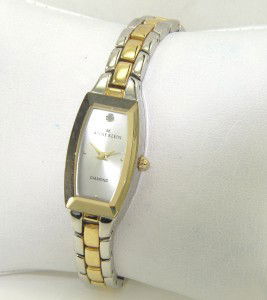 Anne Klein Stainless Steel Watch: Anne Klein Stainless Steel Watch.The total watch's weight is 37.8 grams.The measurements of the watch head is 27 x 16 mm and 7 mm in thick.The length of watch: 7.25".Water Resistant.Chain is 8 mm wide