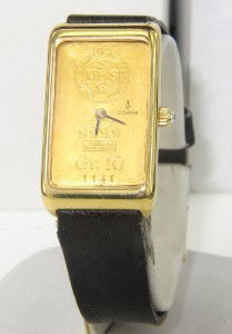 Corum 18K Yellow Gold Leather Strap Watch: Corum 18K Yellow Gold Leather Strap Watch. The total watch's weight is 39.9 grams. The total The size of watch head: 32 x 19 mm and 4 mm thick. The length of the watch is 9". Swiss Made. Water Resista