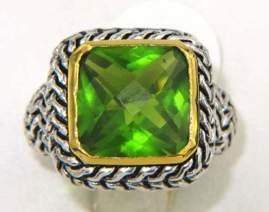 Silver Tsavorite Ring: Silver Tsavorite Ring The total ring weight is 12.4 grams. The measurements of tsavorite: 10 x 10 mm. The size of ring surface: 17 x 17 mm and 8 mm in thickness. The size of ring: 7.