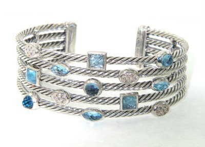 David Yurman Silver Diamond & Blue Topaz Bangle: David Yurman Silver Diamond & Blue Topaz Bangle Bangle's Weight : 52.2 grams The weight of diamond: 0.21 cts, H color,VS clarity. The size of blue topaz: 3 - 4 mm The measurements of the Inside Bangle