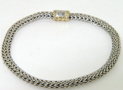 John Hardy Silver /18K Yellow Gold Bracelet: John Hardy Silver/18K Yellow Gold Bracelet. The total Bracelet's weight is 15.9 grams. The length of bracelet: 7.5", 2 mm thick