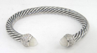 David Yurman Silver Moon Quartz & Diamond Bangle: David Yurman Silver Moon Quartz & Diamond Bangle.The total Bangle's weight is 42.7 grams.The total diamond weight is 0.64 cts. approxmiately, H - I color VS - SI clarity.The size of Moon Quartz : 9 mm