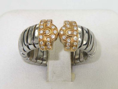 Bvlgari 18K Yellow Gold/Steel Diamond Ring: Authentic Bvlgari 18K Yellow Gold and Steel Diamond Ring.The total ring's weight is 9.2 grams.The diamonds weight are approximately 0.34 cts., approximately. G color and VS clarity.The ring is 7 mm wi