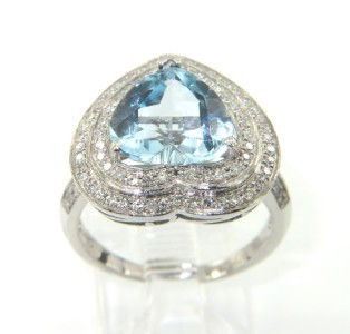 14K White Gold, Blue Topaz & Diamond Ring: 14K White Gold, Blue Topaz & Diamond Ring. The total ring's weight is 4.6 grams. The total weight of Diamond is approximately 0.65 cts. I color SI clarity. The size of Blue Topaz is 12 x 12 mm. The me