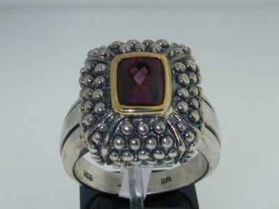 BJC 14k Yellow Gold/Silver Rhodolite Ring.: BJC 14k Yellow Gold/Silver Rhodolite Ring. The total ring's weight is 11.5 grams. The measurement of the ring's face is 19x17 mm, Thickness: 9 mm. The size of the rhodolite is 5x7 mm. The size of the