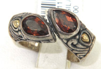 BJC 18K Yellow Gold/Silver Garnet Ring: BJC 18K Yellow Gold/Silver Garnet Ring The total ring's weight is 9 grams. The measurement of the ring's face is 23 x 8 mm, Thickness: 5 mm. The sizes of the Pear shape Garnet are 5 x 7 mm, each. The