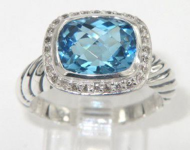 David Yurman Silver Blue Topaz & Diamond Ring: David Yurman Silver Blue Topaz & Diamond Ring The total ring's weight is 5.1 grams. The total weight of the diamond is 0.24 cts approximately, I color SI clarity. The size of the blue topaz is 8 x 6 m