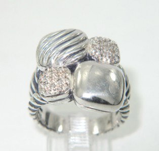 David Yurman Silver Diamond Ring: David Yurman Silver Diamond Ring The total ring's weight is 14.1 grams. The total diamond weight : 0.20 ct. I color, SI clarity. The measurement of ring surface: 16 x 16 mm , 4 mm thickness. The size 