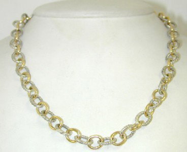 David Yurman Silver 18K Yellow Gold Necklace: David Yurman Silver18K Yellow Gold Necklace The total weight of Necklace is 31.8 grams. The length of the necklace is 16.25". The necklace is 7 mm wide.