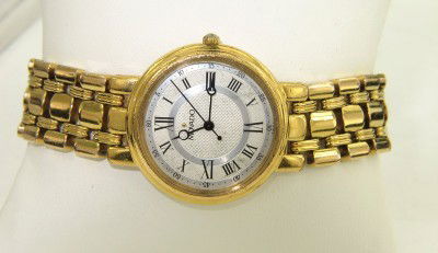 Movado Stainless Steel Roman Numerals Watch: Movado Stainless Steel Roman Numerals Watch The total watch's weight is 45.2 grams. The measurements of the watch head is 25 x 25 mm and 5 mm thick. The length of watch: 6.5". Swiss Made. Water