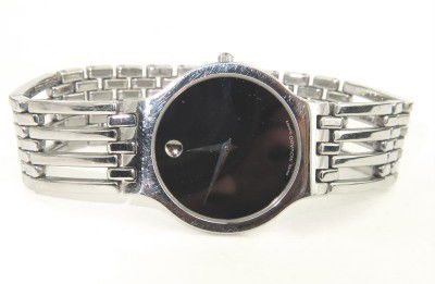 Movado Stainless Steel Watch: Movado Stainless Steel Watch The total watch's weight is 66.2 grams. The measurements of the watch head is 27 x 31 mm and 4 mm thick. The length of watch: 7.75". Swiss Made. Water Resistant.