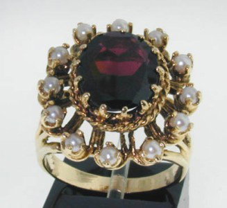 14K Yellow Gold Pearl & Garnet Ring: 14K Yellow Gold Pearl & Garnet Ring. The total ring's weight is 8.6 grams. The size of garnet is 12 x 10 mm. Total 12 Pearl on the ring, 2.5 mm in diameter, each. The size of the ring is 7.5.