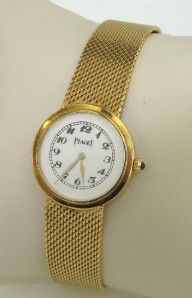 Piaget 18K Yellow Gold Watch: Piaget 18K Yellow Gold Watch. The total watch's weight is 39.5 grams. The measurements of watch head is 23 x 23 mm and 3 mm thick. The length of watch: 6.5". swiss made. Water Resistant. Chain is 12 m