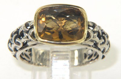 Charles Krypell Gold/Silver Citrine Ring: Charles Krypell 14K Gold/Silver Citrine Ring The total ring's weight is 4.2 grams. The size of the citrine is 8 x 6 mm. The measurement of ring's surface is 10 x 8 mm and 5 mm thick. The size of the r