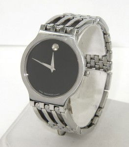 Movado Stainless Steel Watch: Movado Stainless Steel Watch The total watch's weight is 66.2 grams. The measurements of the watch head is 27 x 31 mm and 4 mm thick. The length of watch: 7.75". Swiss Made. Water Resistant. Chain is