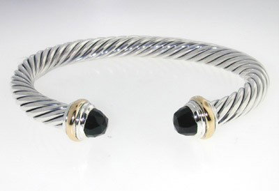 David Yurman Silver /14K Gold, Onyx Bangle.: David Yurman Silver/14K Yellow Gold, Onyx Bangle. The total Bangle's weight is 39.3 grams. The size of Onyx: 6 mm The measurement of the inside bangle is 55 x 45 mm, Thickness: 6 mm.