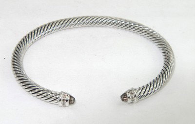David Yurman Silver Smoky Topaz & Diamond Bangle: David Yurman Silver Smoky Topaz & Diamond Bangle Bangle's Weight: 24.6 grams. The weight of diamond: 0.09 pts, I color, VS - SI clarity. The size of smoky topaz: 2 x 2 mm. The measurements of the Insi