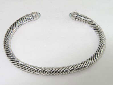 David Yurman Silver Blue Topaz & Diamond Bangle: David Yurman Silver Blue Topaz & Diamond Bangle Bangle's Weight: 25.5 grams. The weight of diamond: 0.09 pts, I color, VS - SI clarity. The size of blue topaz: 2 x 2 mm. The measurements of the Inside