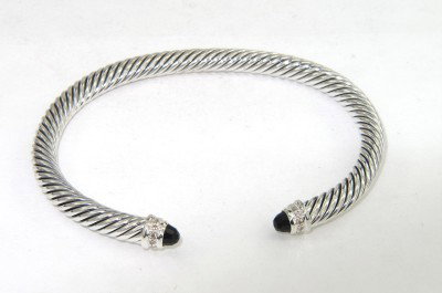 David Yurman Silver Onyx & Diamond Bangle: David Yurman Silver Onyx & Diamond Bangle Bangle's Weight: 26 grams. The weight of diamond: 0.09 pts, I color, VS - SI clarity. The size of onyx: 3 x 3 mm. The measurements of the Inside Bangle is 53 