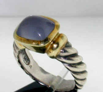 David Yurman Silver & 14K Yellow Gold Chalcedony: David Yurman Silver & 14K Yellow Gold Chalcedony Ring. The total ring's weight is 8.1 grams. The size of the Chalacedony is 10 x 8 mm. The measurement of ring's surface is 15 x 11 mm and 9 mm thick. T