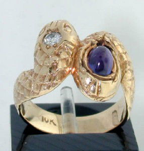 10k Yellow Gold Diamond and Amethyst Ring: 10k Yellow Gold Diamond and Amethyst Ring The total ring's weight is 4.9 grams. The weight of Diamond: 0.07pts, approoximately H color, SI-1 calarity The size of Amethyst: 4x2mm The size of the ring i