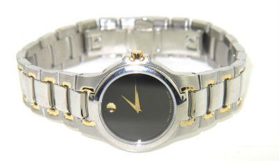 Movado 2-Tone Stainless Steel Watch: Movado 2-Tone Stainless Steel Watch. The total watch's weight is 57.8 grams. The measurements of the watch head is 25 x 25 mm in diameter and 4 mm thick. The length of watch: 7". Swiss Made. Water Res
