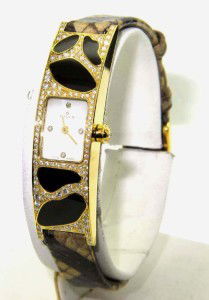 Milus 18K Gold Diamond,Enamel Leather Strap Watch: Brand New Milus 18K Yellow Gold Diamond,Enamel Leather Strap Watch With Box.The total watch's weight is 33.6 grams.The total weight of diamond: 2 cts. G color VVS clarity.The measurements of the watch
