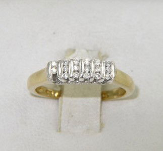 10K 2-Toned Gold Diamond Ring: 10K 2 -Toned (Yellow-White) Gold Diamond Ring The total ring's weight is 3.4 grams. The total diamond weight is 30 pts., approximately. I color, SI clarity. The size of the ring is 7.