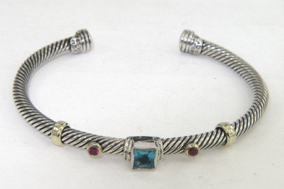 David Yurman 14K Yellow Gold/Silver Multi-Stone Ba: David Yurman 14K Yellow Gold/Silver Multi-Stone Bangle Bangle's Weight: 18.3 grams. Multi-Stone are blue topaz & Tourmaline. The measurements of the inside Bangle: 55 x 45 mm and thickness is 3 mm.