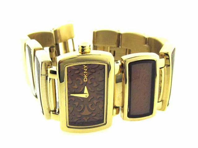 DKNY NY 4328 Watch: This is DKNY NY 4328 Watch. The watch is Gold Plated with Gold Tone Bracelet. The case diameter is 30 mm with 6 mm thickness. The watch has a brown colored dial with Quartz movement. The watch is wate
