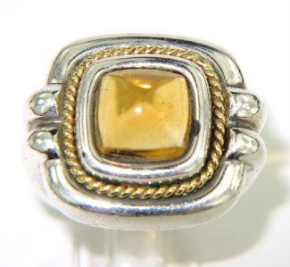 Tiffany & Co Silver/18K Yellow Gold Citrine Ring: Tiffany & Co Silver/ 18K Yellow Gold Citrine Ring The total ring's weight is 15.1 grams. The measurement of citrine: 8 x 8 mm. The measurement of ring's surface: 19 x 19 mm and 6 mm in thickness. The 