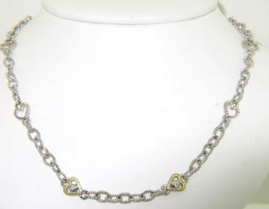 Judith Ripka Silver & 18K Yellow Gold Diamond Necklace: Judith Ripka Silver & 18K Yellow Gold Diamond Necklace. The total weight of Necklace is 14.4 grams. The total weight of diamond: 0.06 pts. approximately. H color VS clarity. The necklace is 3 mm wide