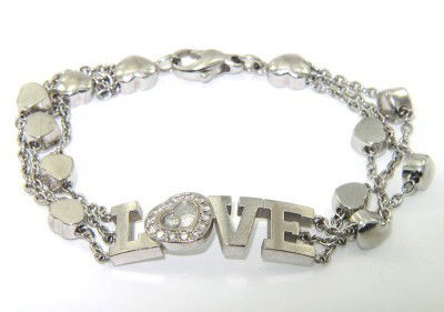 Chopard 18K White Gold, Happy Diamond Love Bracelet: Chopard 18K White Gold, Happy Diamond Love Bracelet. The bracelet weight is 26.6 grams. The total weigth of diamond: 0.31 cts. G color, VS clarity. The measurements of bracelet: 6.75" long. The size o