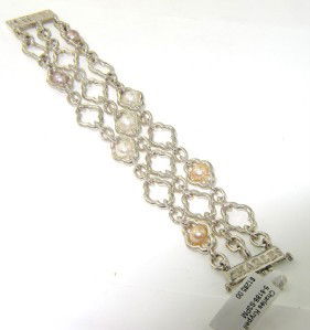 Charles Krypell Gold/Silver Pearl Bracelet: Charles Krypell 14K Gold/Silve Pearl Bracelet Weight of Bracelet: 45.1 grams The measurement of pearl: 5 x 5 mm The length of Bracelet: 7" The bracelet is 25 mm wide and 1 mm in thickness