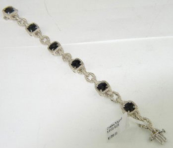 Charles Krypell Gold/Silver Onyx Bracelet: Charles Krypell 14K Gold/Silve Onyx Bracelet Weight of Bracelet: 24.1 grams The measurement of onyx: 6 x 6 mm The length of Bracelet: 7.25" The bracelet is 9 mm wide and 5 mm in thickness