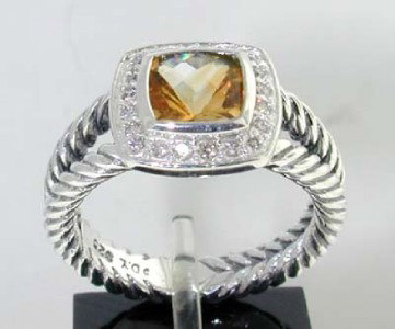 David Yurman Silver Citrine & Diamond Ring: This is a Wonderful David Yurman Silver Citrine & Diamond Ring. The total ring's weight is 5.5 grams. The total weight of the diamond is 0.2 cts approximately, I color SI clarity. The size of the Citr