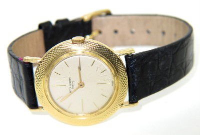 Patek Philippe 18K Yellow Gold Leather Strap Watch: Patek Philippe 18K Yellow Gold Leather Strap Watch. The total watch's weight is 30.2 grams. The measurements of watch head is 30 x 30 mm and 5 mm thick. Dial: Gold Stick dial. Movement: Manual. The le