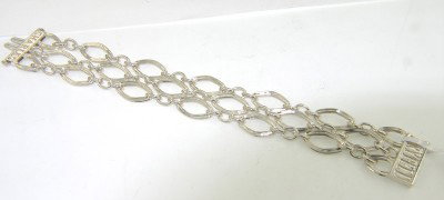 Charles Krypell Gold/Silver Bracelet: Charles Krypell 14K Gold/Silve Bracelet Weight of Bracelet: 38.2 grams. The length of Bracelet: 7". The bracelet is 22 mm wide and 1 mm in thickness.