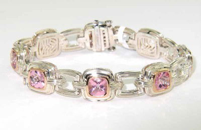 Charles Krypell 14K Gold Silver Steel Topaz Brace: Charles Krypell 14K Gold / Stainless Steel Pink Topaz Bracelet Weight of Bracelet: 33.2 grams. The measurement of pink topaz: 5 x 5 mm. The length of Bracelet: 7". The bracelet is 13 mm wide and 6 mm