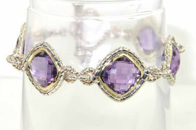 Charles Krypell Gold Silver Amethyst Bracelet: Charles Krypell 14K Gold/Stainless Steel Amethyst Bracelet Weight of Bracelet: 32.2cgrams. The measurement of amethyst: 11 x 11 mm. The length of Bracelet: 7.5". The bracelet is 19 mm wide and 6 mm in