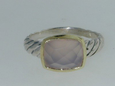 David Yurman 18k Gold/Silver Pink Quartz Ring.: This is a Wonderful David Yurman 18k Yellow Gold/Silver Pink Quartz Ring. The total ring's weight is 4.0 grams. The size of the Pink Quartz is 11x9 mm. There is D.Y,"925" & "750"stamp on it. The size 